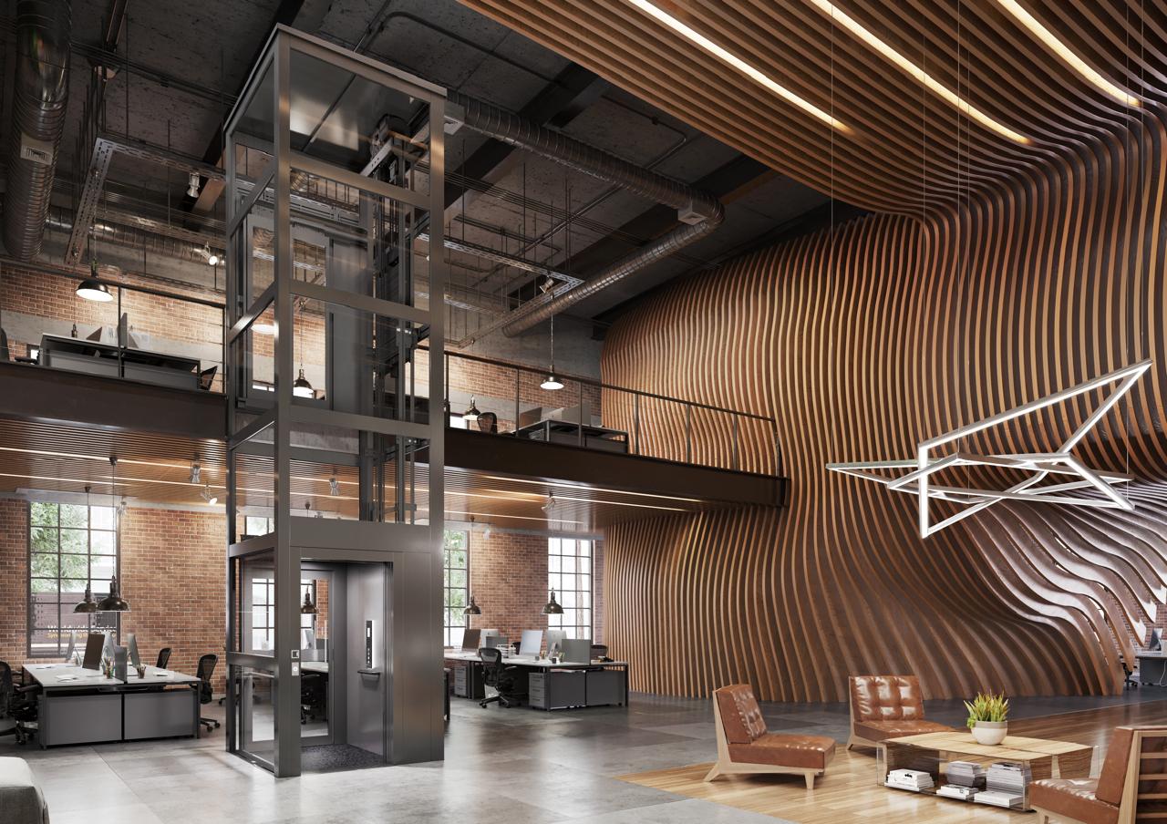 A platform lift with glass walls in a public building.